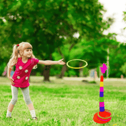 Aiming a ring toward a colorful target stand.